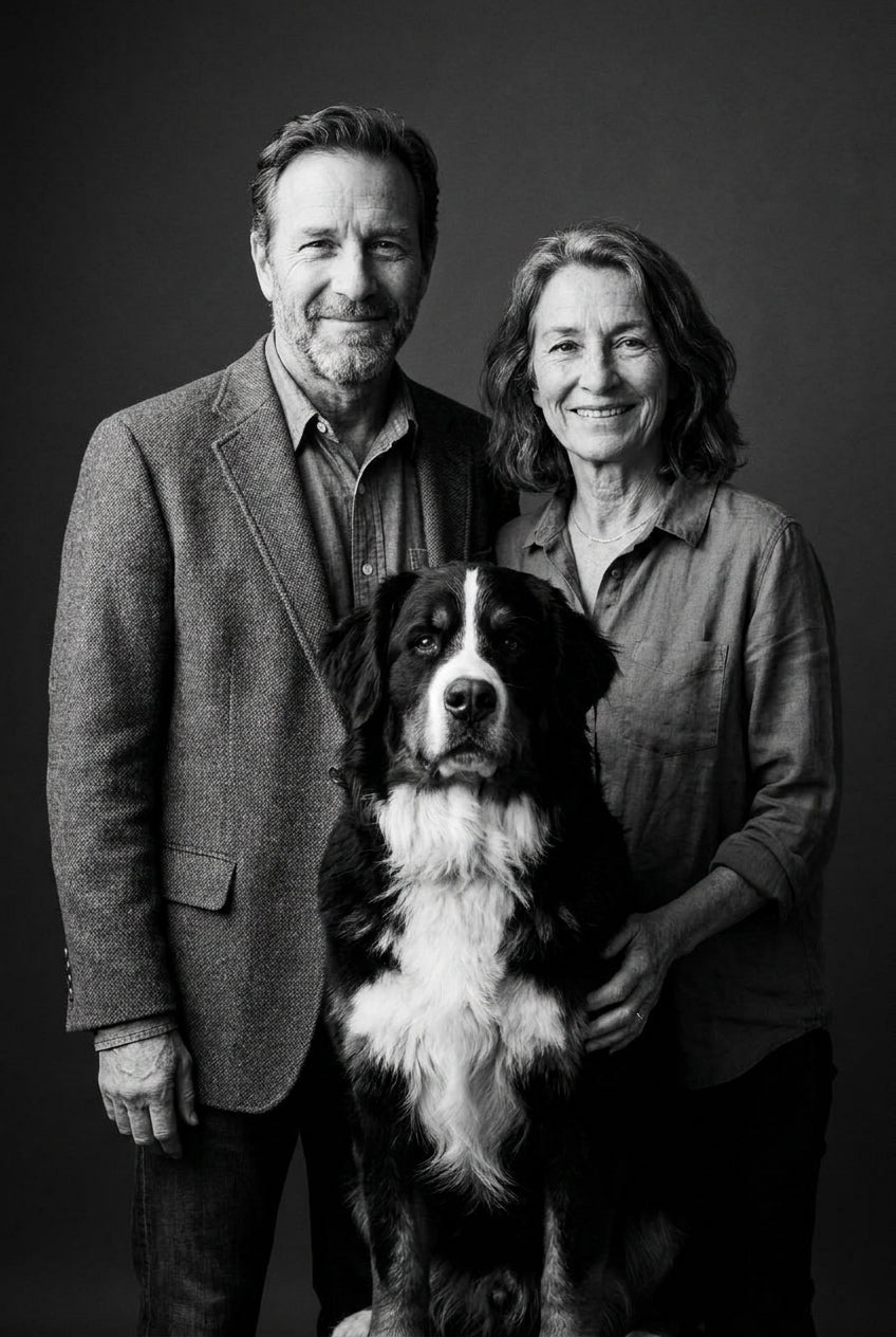 AI black and white portrait of a couple with their Bernese Mountain Dog, fine-art studio photography